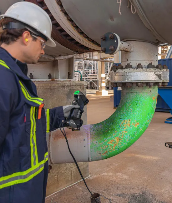 ndt solutions refinery man scanning elbow analysis